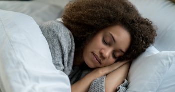 5 do’s for a good night’s sleep Portrait of a beautiful African American woman sleeping in bed and looking very peaceful - lifestyle concepts