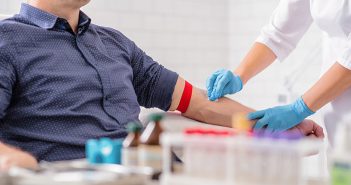 Hepatitis A: What You Need to Know Male patient in tourniquet as nurse prepares his arm for a vaccination.