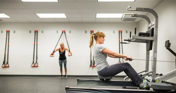 Can Your Heart Get Younger with Exercise? Woman exercising on rowing machine.