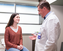 Doctor Flora Speaks with a Patient