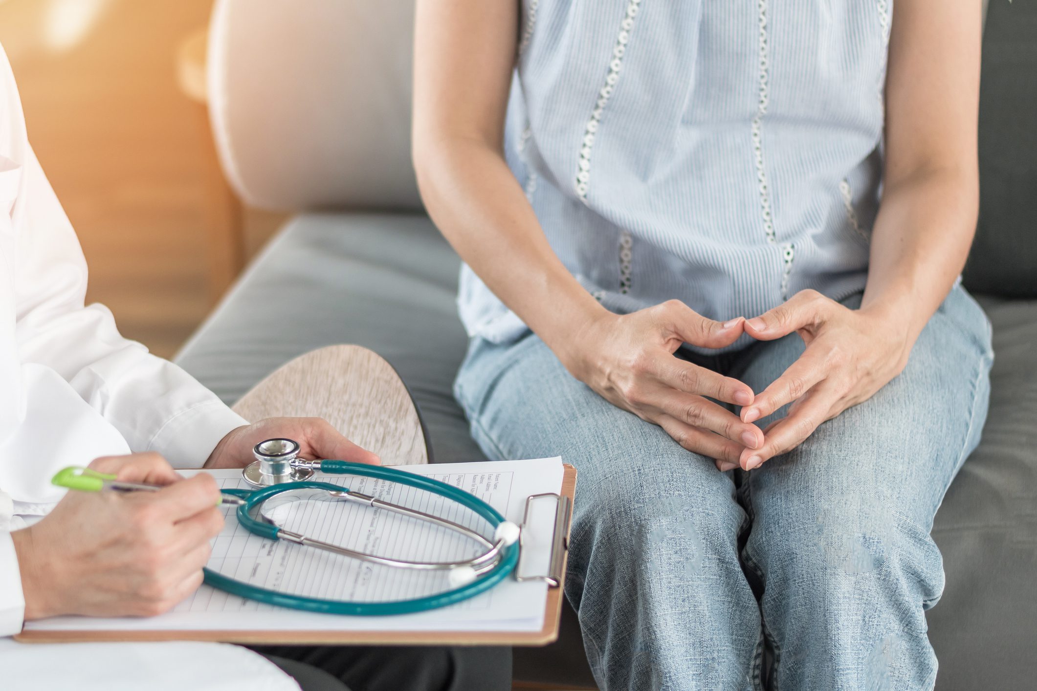 Doctor consulting woman patient