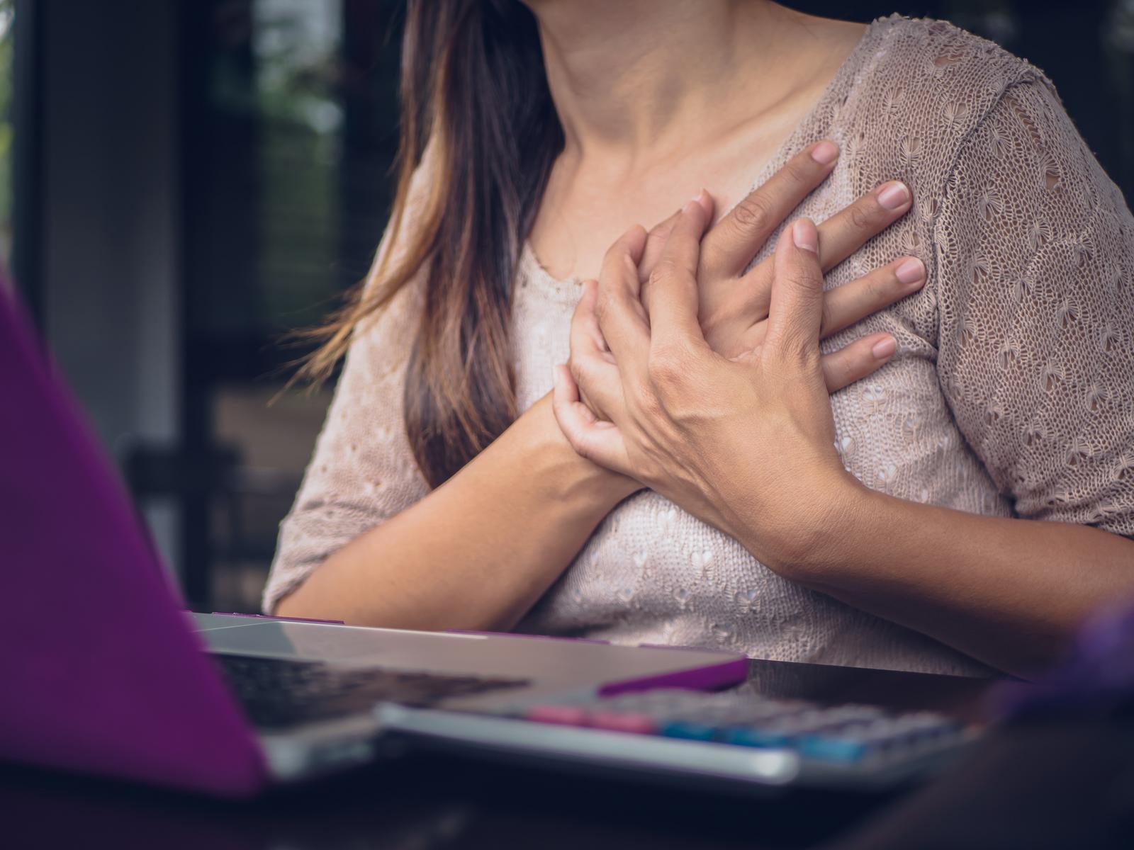 Closeup woman having heart attack. Closeup woman having heart attack.