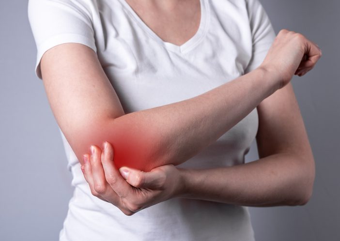 Woman in elbow pain.