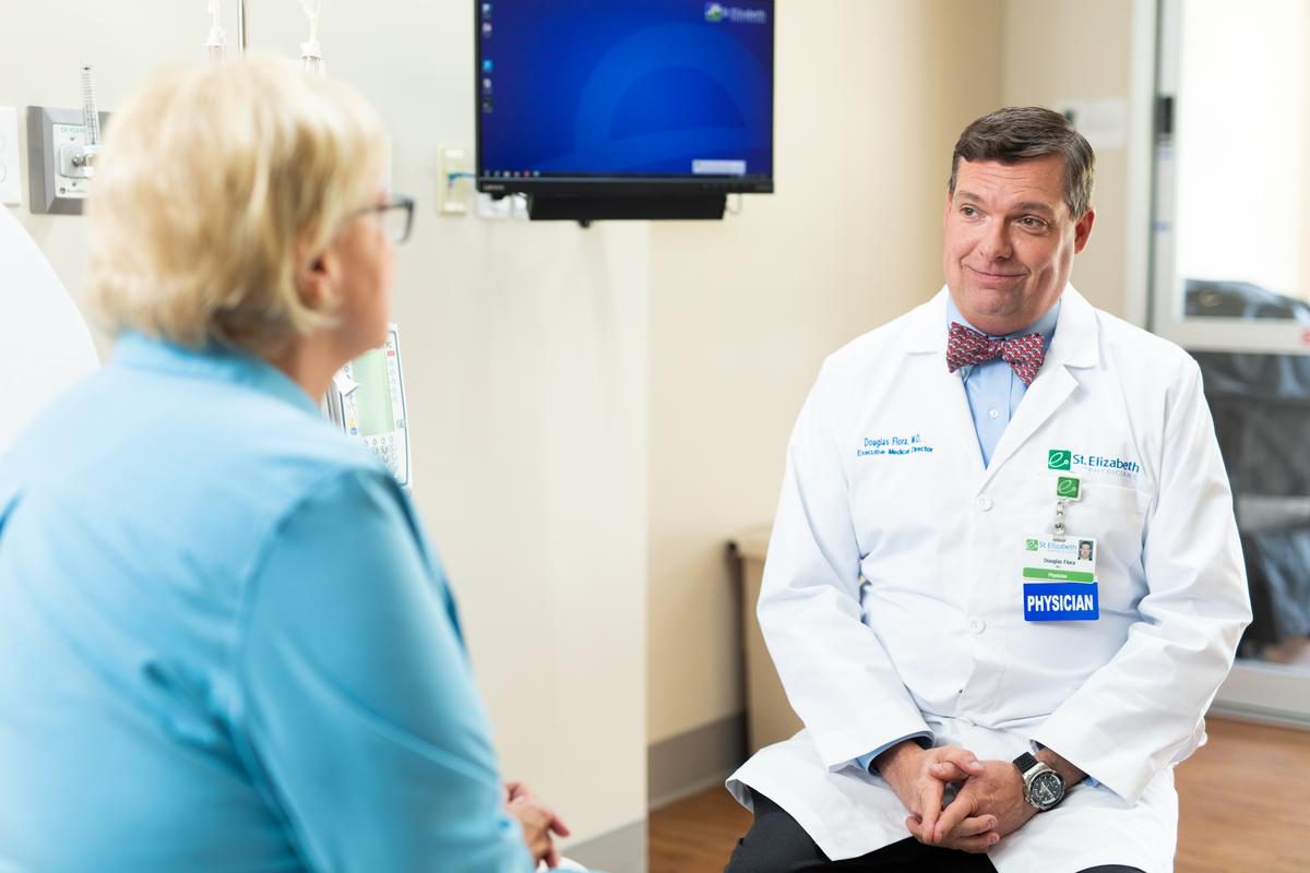 Dr. Doug Flora listens to a patient. 