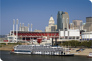 Reds Stadium and a Riverboat from a Ohio River. 