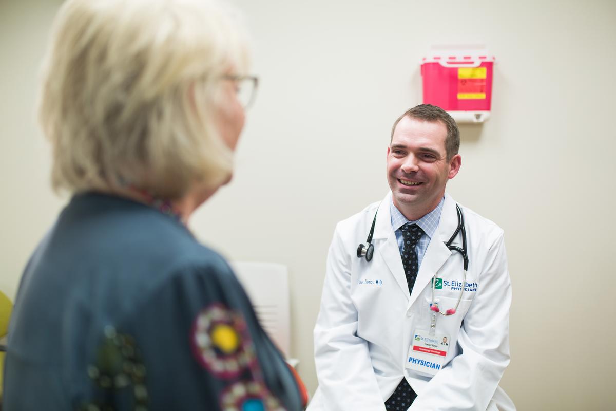 Dr. Dan Flora speaks with a Patient.