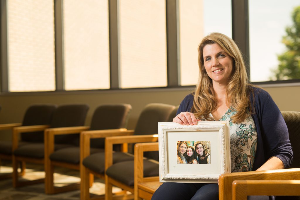 Mandy Laws holding picture of her family