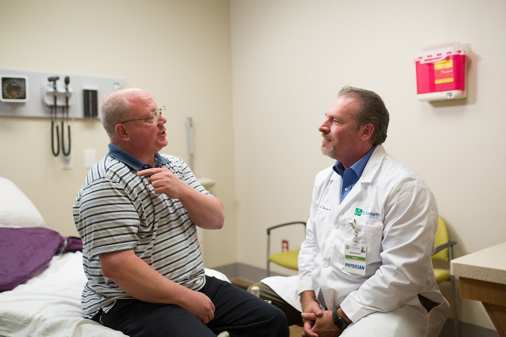 Dr. Michael Bertram examines male patient