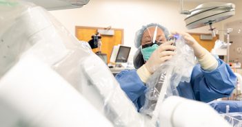 Surgeon prepares for robotic-assisted surgery