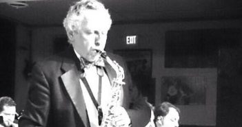 Ken Foltz playing sax, black and white photo