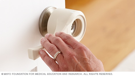 A lever that attaches to doorknobs