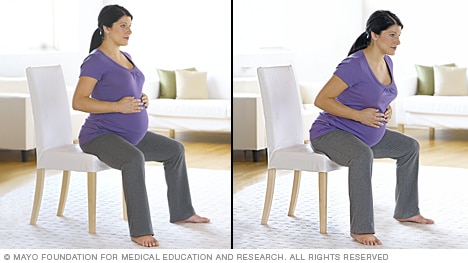 A person in labor rocking while seated