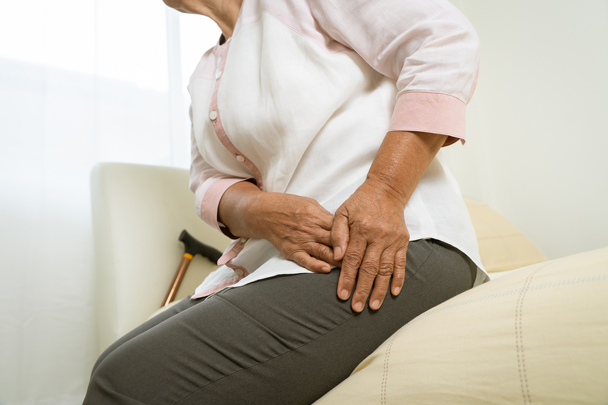 Hip pain of senior woman at home, healthcare problem of senior concept Senior Women with Hip Pain