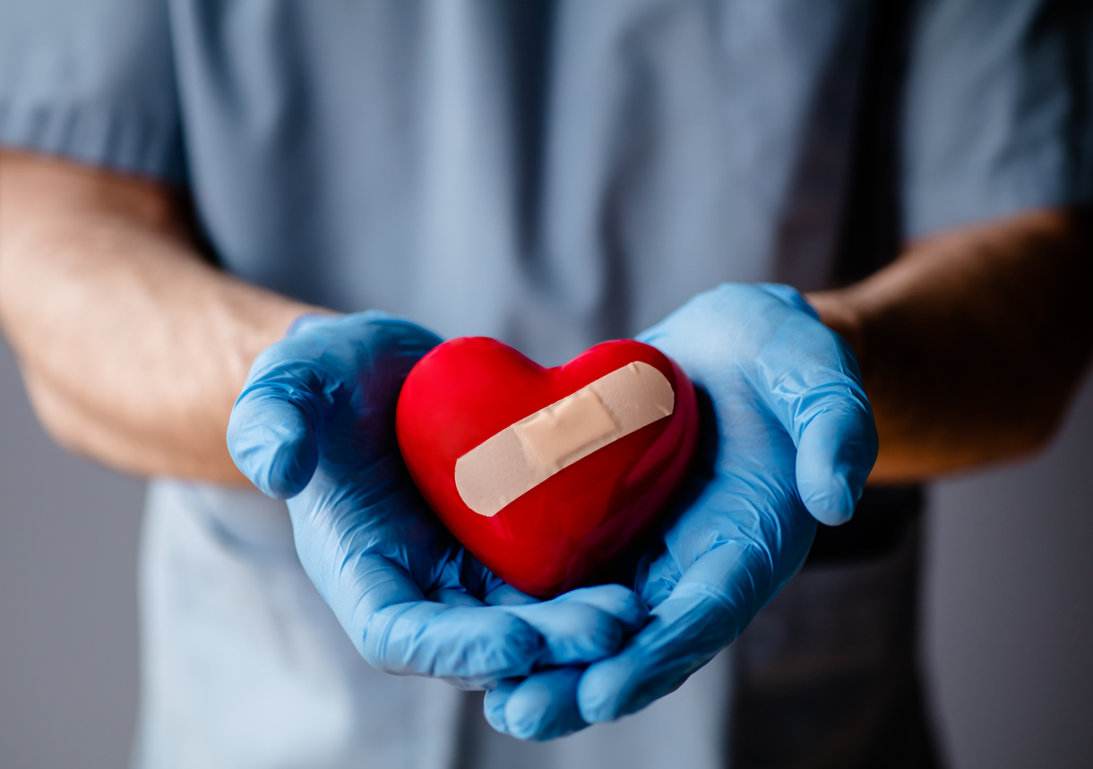 Doctor holding heart Minimally Invasive Heart Surgery